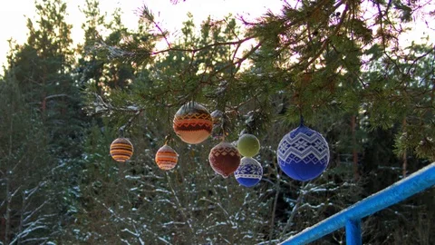 Christmas balls hanging on pine branches covered with snow Stock Footage 70294235