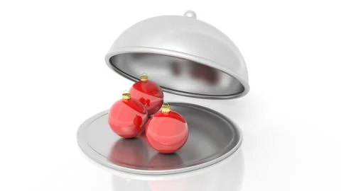 Christmas balls inside open serving dome dish, isolated on white background. Stock Photos