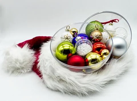 Christmas balls tree inside a Santa Christmas hat isolated on white Stock-Fotos