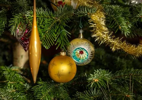 Christmas Bauble on Tree. Festive decorations on a Christmas tree. Stock Photos