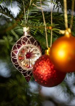 Christmas Bauble on Tree. Festive decorations on a Christmas tree. Stock Photos