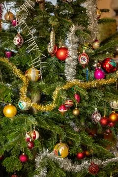 Christmas Bauble on Tree. Festive decorations on a Christmas tree. Stock Photos