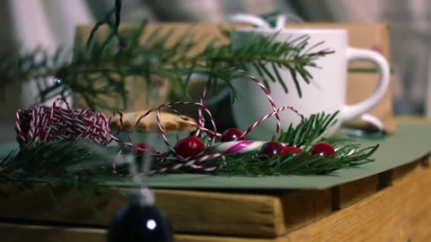 Christmas bauble on tree with hot drink in background Stock Footage 327221737