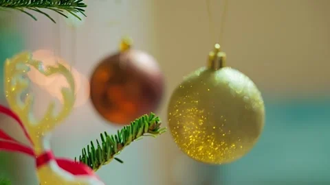 Christmas Baubles With Focus Shift And Twinkling Holiday Lights On Tree Stock Footage 340873636
