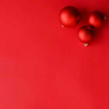 Christmas baubles on red flatlay backdrop, luxury winter holiday card backgro Stock Photos