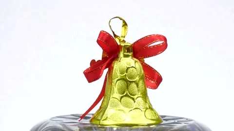 Christmas bell rotates on a light background Stock Footage 161570835