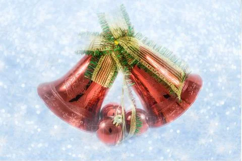 Christmas bells with bow on shiny background snowflakes Stock-Illustration