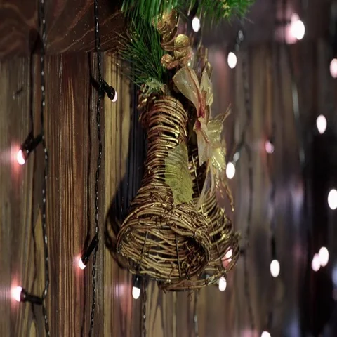 Christmas bells with electric garland around. Stock Footage
