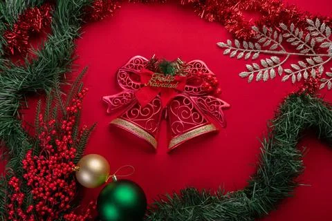 Christmas bells on red background Stock Photos