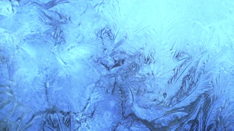 Christmas blue background with frozen pattern on window. Vídeo Stock 212012875