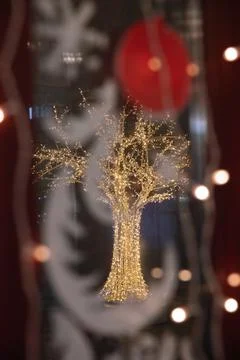 Christmas blurred background through the window you can see the luminous led  Stock Photos