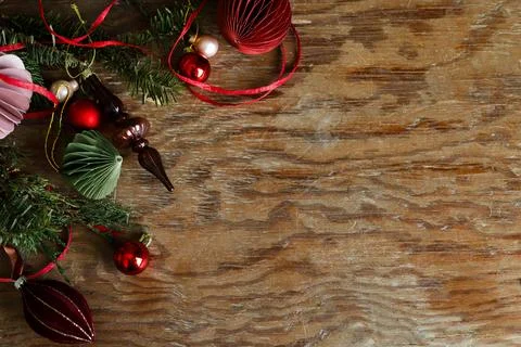 Christmas border. Festive side border of paper ornaments, glass finials, re.. Stock Photos