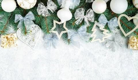 Christmas Border - tree branches with silver decor isolated on white, horizon Stock Photos