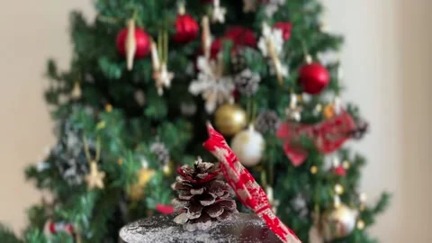 Christmas bow rotating with blurred tree Stock Footage 341611586