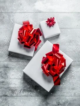 Christmas boxes with bows of different sizes. Stock Photos