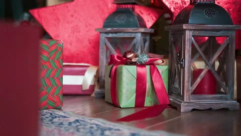 Christmas boxes on the floor. Candlestick. New Year Stock Footage 166711692