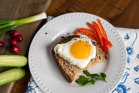 Christmas Breakfast Meal with Egg, Bread, and Vegetables Stock Photos