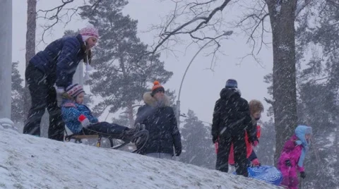 Christmas in Bucha Ukraine Parents Push a Sleigh Kids Riding on a Sleigh Stock Footage 59133512