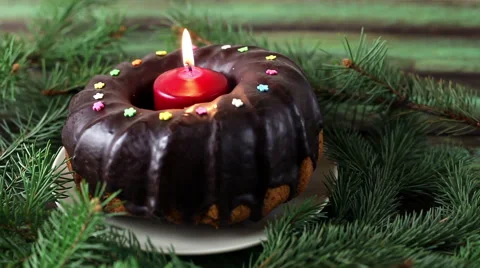 Christmas cake with candle Stock Footage 58005393