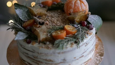 Christmas cake on a stand on the background Видео 98675068