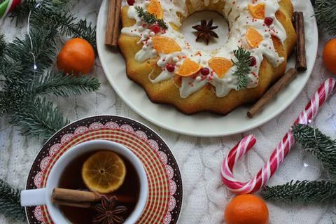 Christmas cake with tea on the table close-up.Texture or background Stock Photos