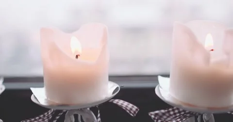 Christmas Candles Burning on the window, Snowfall View. 4K SLOW MOTION 120 fps Stock Footage 67220070