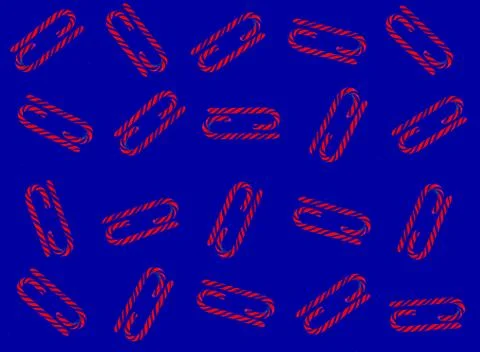 Christmas candy cane pattern on blue background. Flat lay and top view Foto stock