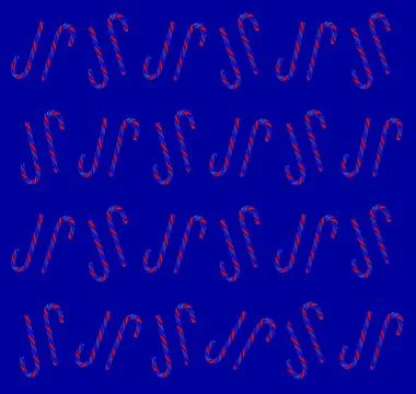 Christmas candy cane pattern on blue background. Flat lay and top view Foto stock
