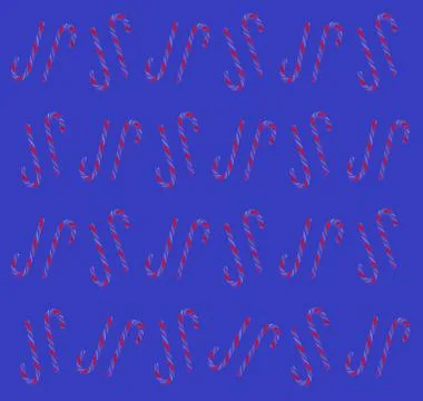 Christmas candy cane pattern on blue background. Flat lay and top view Foto stock