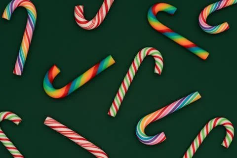 Christmas candy cane pattern on green background. Stock Photos