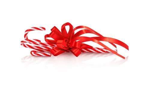 Christmas candy cane with red bow isolated Stock Photos
