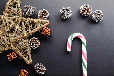Christmas cane candy on black background and christmas decoration Stock-Fotos