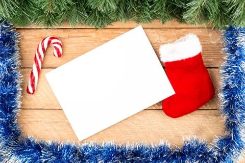 Christmas card, tree branches, paper, boot, candy hook with frame empty spa.. Stock Photos