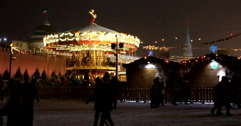Christmas carousel in the  Kremlin, the snowfall, the snow swirls and lights Stock Footage 67396089