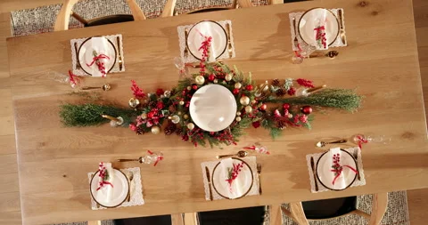 Christmas, celebration and table setting with decorations in home for holiday Stockbeeldmateriaal 312829089