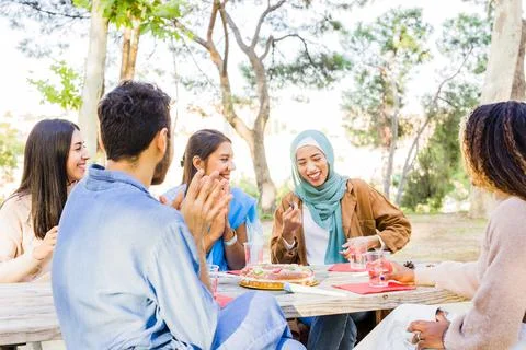 Christmas celebration multiracial group on a table. millennial diverse group Stock Photos