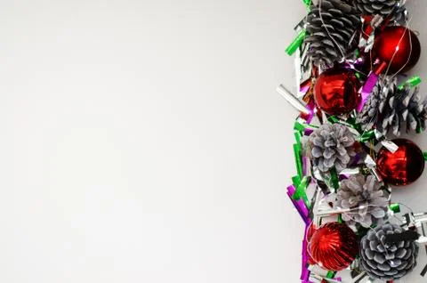 Christmas composition of balls, pine cones and garlands on a white background Stock Photos