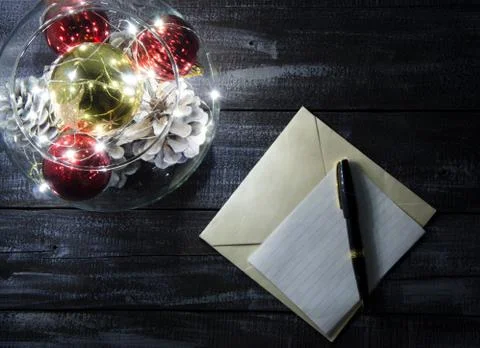 Christmas composition of balls of various sizes and garlands on a dark wooden Stock Photos