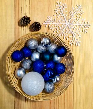 Christmas composition: a basket with blue and silver Christmas toys Stock Photos