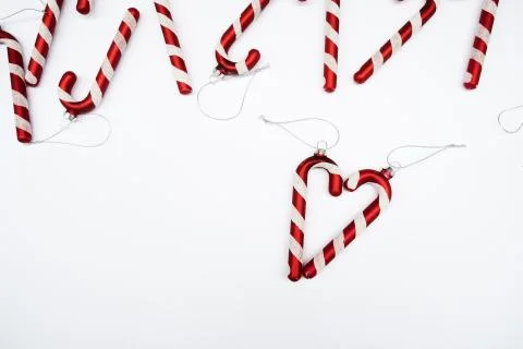 Christmas composition. Border made of red decorations on white background. Stock-Fotos