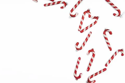 Christmas composition. Border made of red decorations on white background. Stock Photos