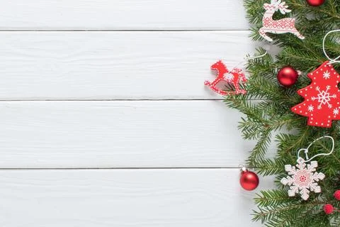 Christmas composition, with branches of a Christmas tree and red and white Ch Stock Photos