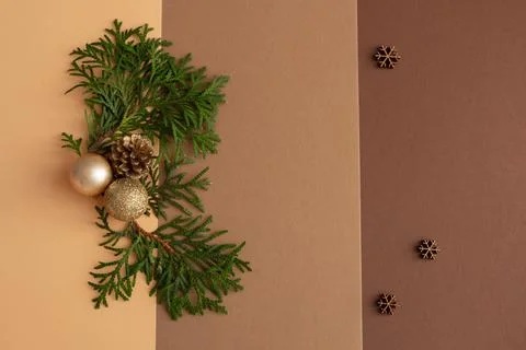Christmas composition on a brown background, spruce, christmas balls, copy space Stock Photos