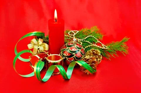 Christmas composition with a candle Stock Photos