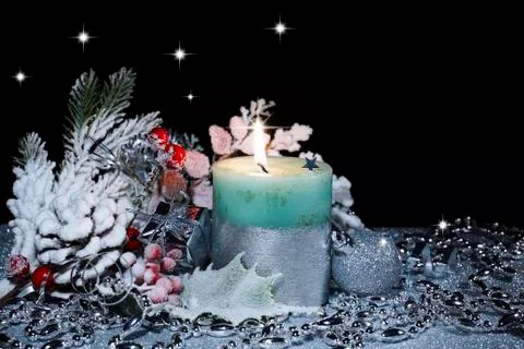 Christmas composition with a candle Stock Photos