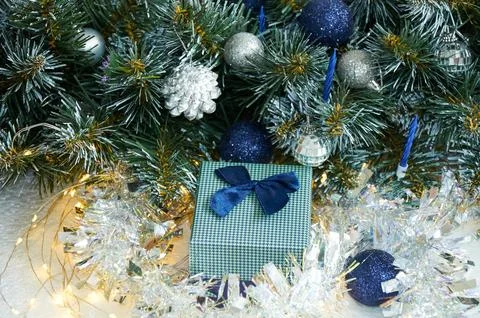 Christmas composition with Christmas tree branches in blue and silver balls.. Stock Photos