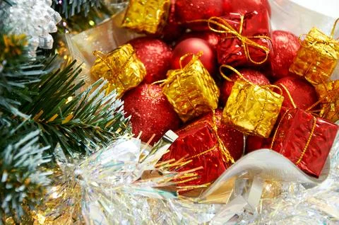 Christmas composition with Christmas tree branches, red balls on yellow gif.. Stock Photos