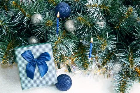 Christmas composition with Christmas tree branches in blue and silver balls.. Stock Photos
