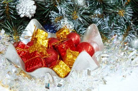 Christmas composition with Christmas tree branches, red balls on yellow gif.. Stock Photos