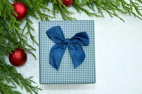 Christmas composition with Christmas tree branches, red tinsel, gift boxes .. Stock Photos